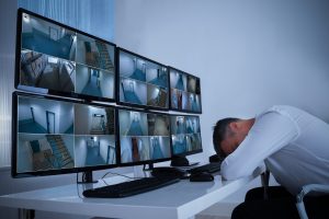 Secuirty officer sleeping at desk